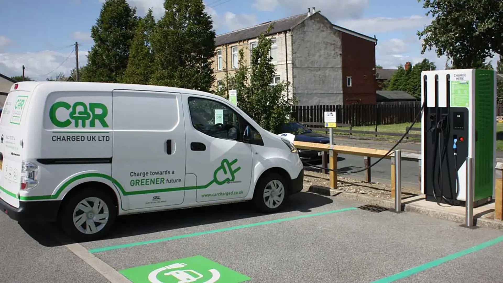 Car Charged UK electric van DC charger in parking lot