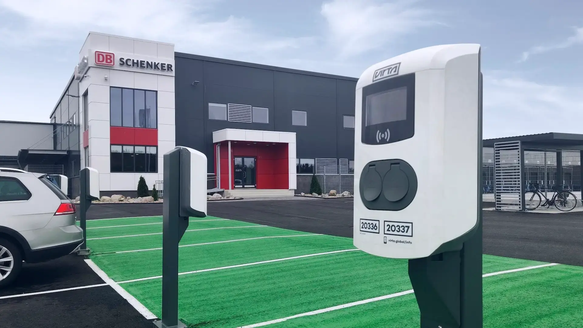 DB Schenker Finland logisitc center parking lot equipped with ac charging stations on poles