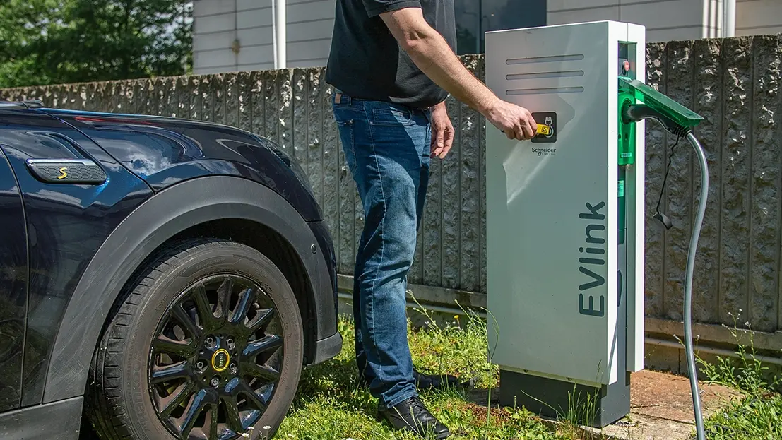 man using rfid badge for vehicle charging