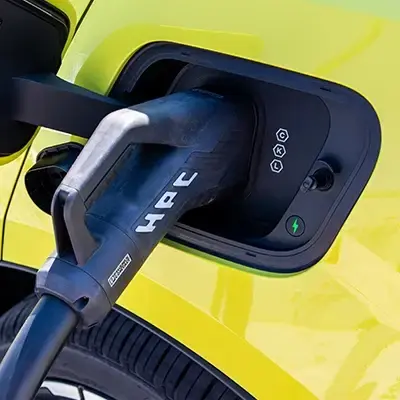 Yellow EV with HPC charging connector