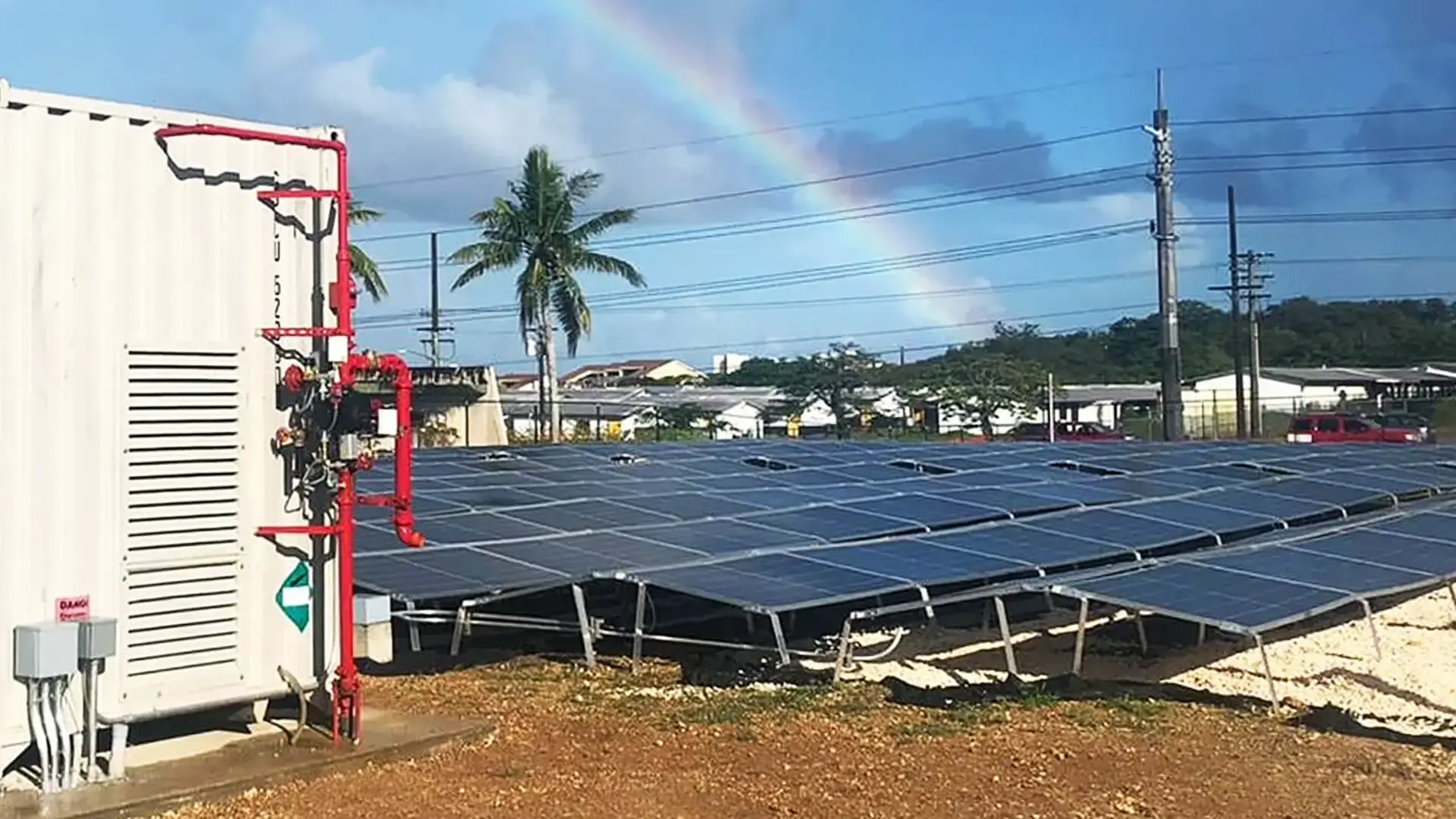 Solar panels with a rainbow in the background in South-East Asia