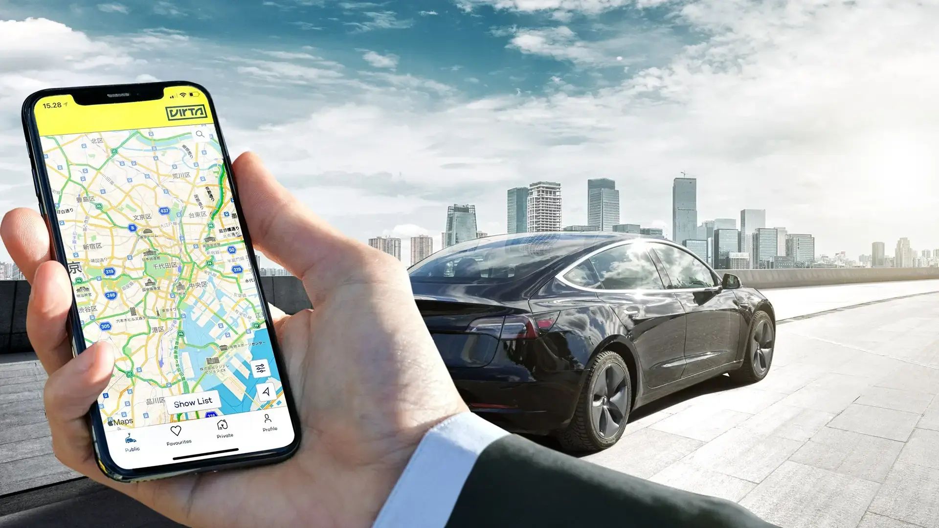 virta-app-in-front-of-black-car-big-city-landscape