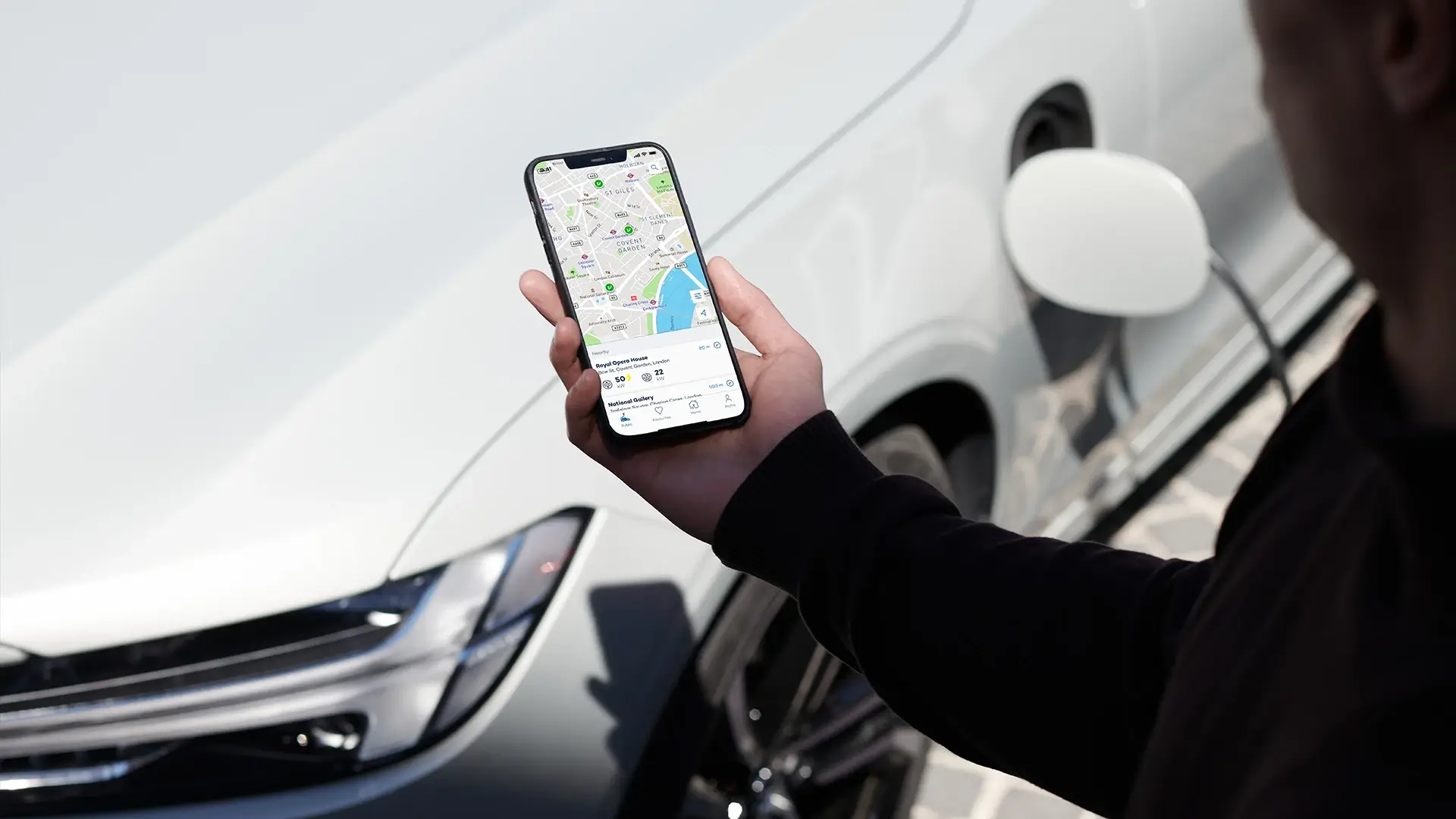 Smartphone EV charging app screen map car background
